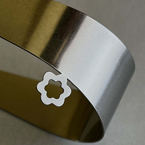 Flower detail on between you and me stainless steel serving tongs