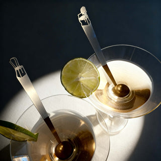 Best Seat in the House stainless steel tiny serving ladles resting in cocktail glasses with lime slices