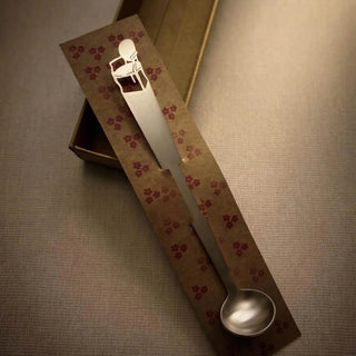 Cabriole stainless steel tiny serving ladle presented in a hand-stamped kraft gift box