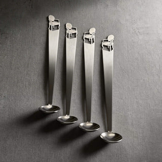 Quartet of Cabriole stainless steel tiny serving ladles on a textured grey surface
