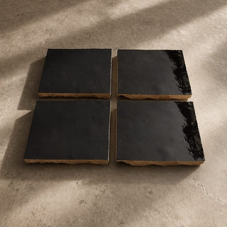 Set of four Cocoa Brown handcrafted ceramic table tiles with glossy dark brown finish and natural clay edges