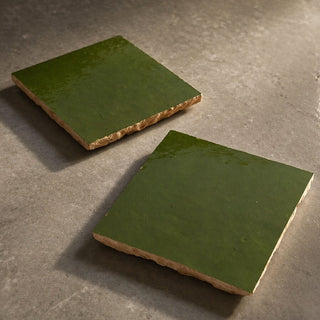 Pair of Garden Green handcrafted ceramic table tiles with glossy green glaze and natural clay edges