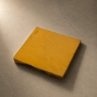 Single Golden Sun ceramic table tile handcrafted in Morocco and hand finished in studio