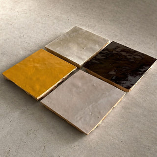 Handcrafted ceramic table tiles in Golden Sun, Soft Cream, Cocoa Brown and neutral glaze finishes