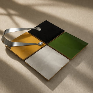 Garden Green, Golden Sun, Soft Cream and Cocoa Brown handcrafted ceramic table tiles styled with the Circles stainless steel server