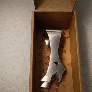 Stainless steel High Heel serving piece presented in kraft gift box with floral lining