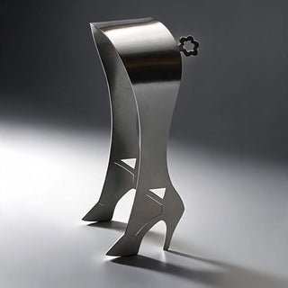 Handcrafted stainless steel High Heel serving piece on neutral tabletop
