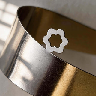 Close-up of handcrafted Between you and me serving piece showing flower-shaped cut-out detail