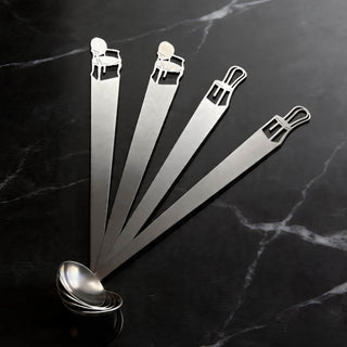 Best Seat in the House tiny serving ladles in mixed Bentwood and Cabriole styles arranged on black marble