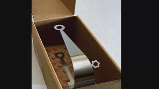 Video showing the Circles handcrafted stainless steel serving pair presented in its patterned gift box, then used to lift a green olive from a bowl.