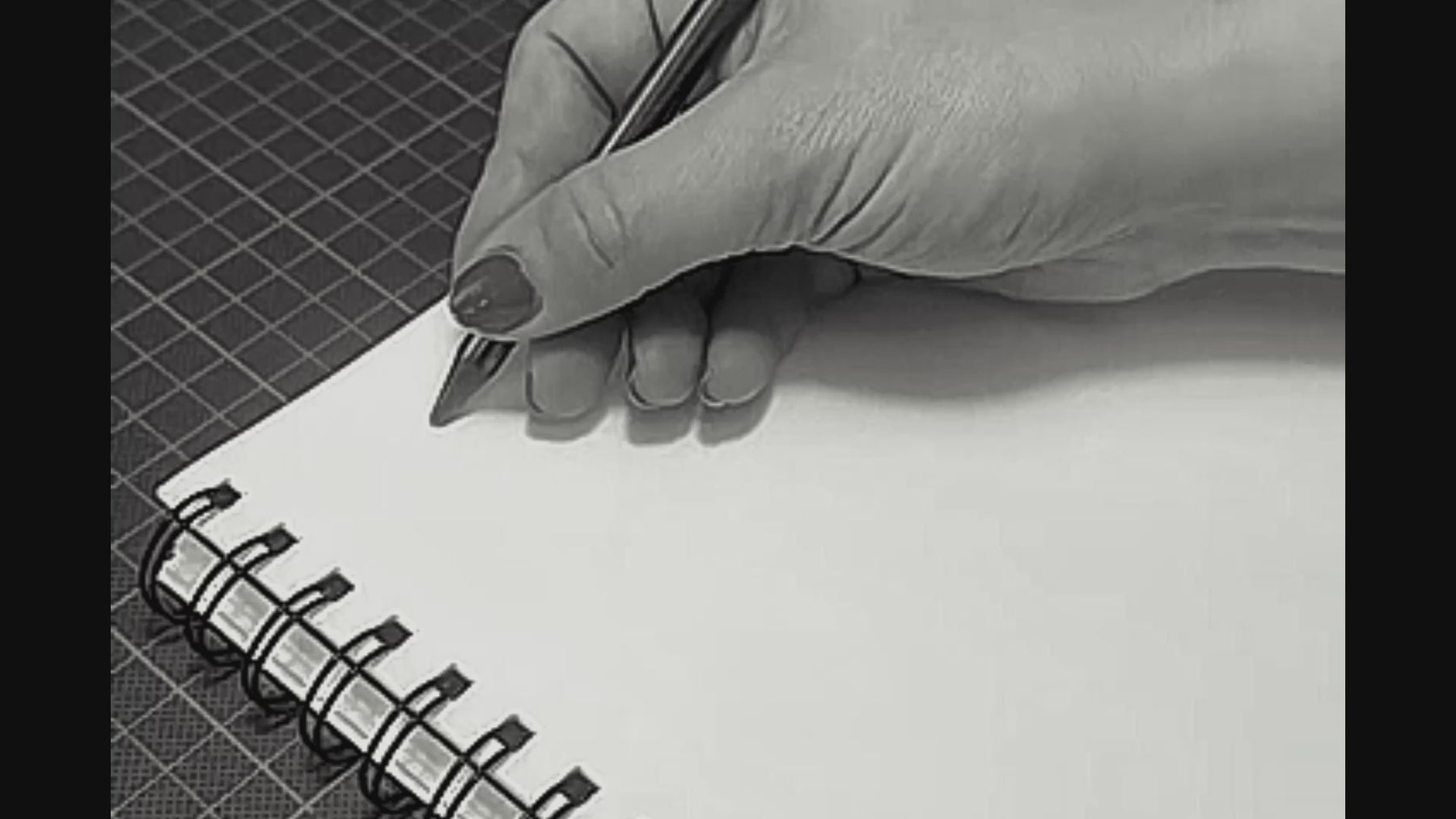 Black and white studio video showing the making process behind Between You and Me, from hand drawing and shaping stainless steel to polishing and table styling and hand stamping the packaging