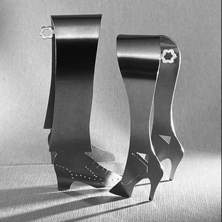 Tap Shoe and High Heel stainless steel serving pieces side by side on textured grey surface
