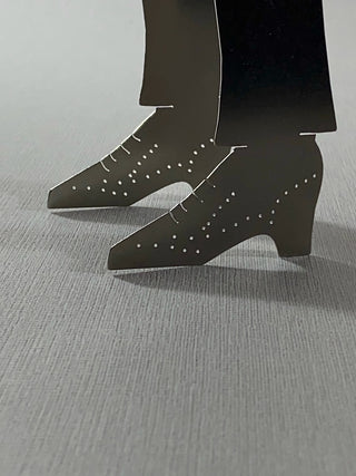 Close-up of handcrafted Tap Shoe servers highlighting perforated shoe detailing